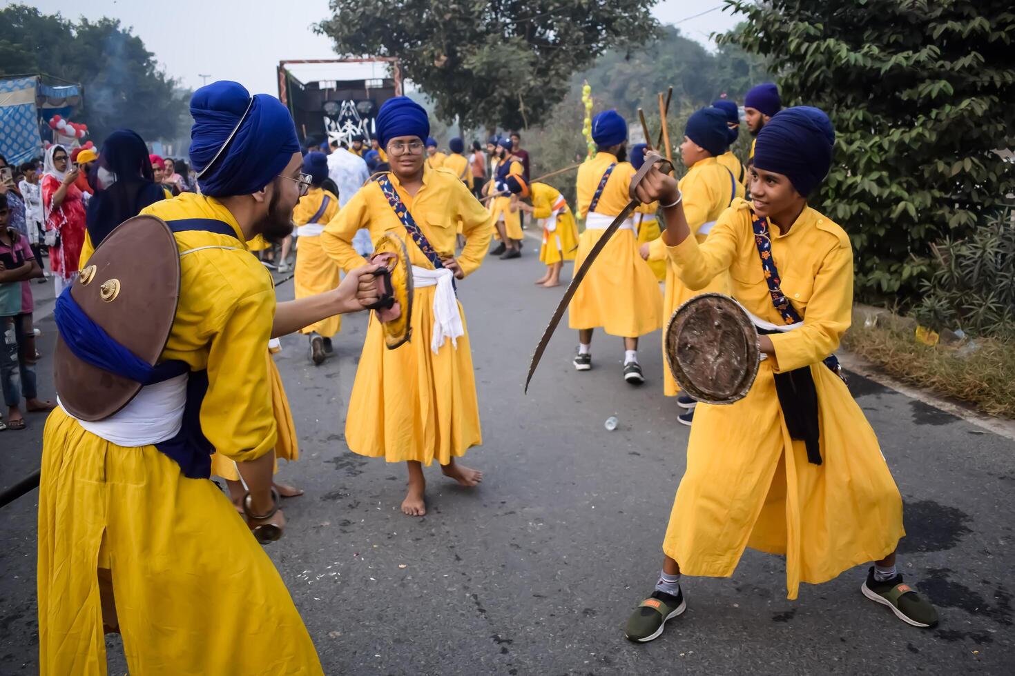 Delhi, India, May 2, 2024 - Sikhs display gatka and martial arts during annual Nagar Kirtan, Traditional, procession on account of birthday of Guru Nanak Dev ji, Nagar Kirtan in East Delhi area photo