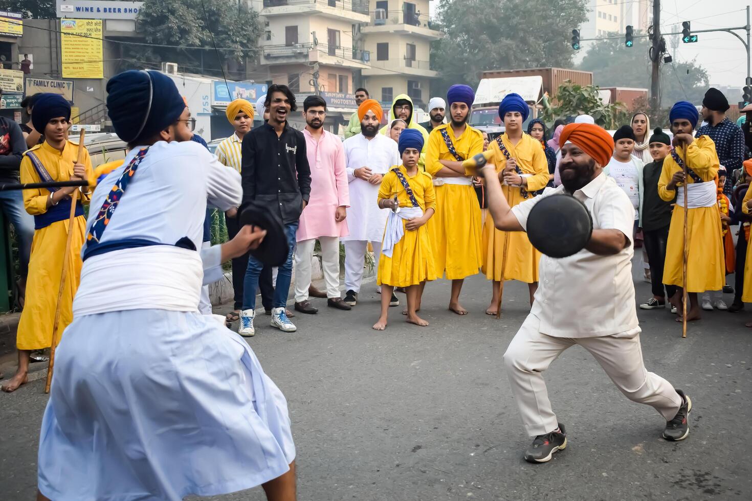 Delhi, India, May 2, 2024 - Sikhs display gatka and martial arts during annual Nagar Kirtan, Traditional, procession on account of birthday of Guru Nanak Dev ji, Nagar Kirtan in East Delhi area photo