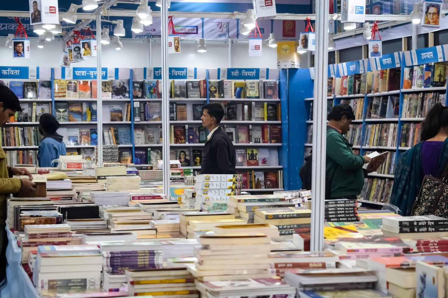 New Delhi, India, May 7 2024 - Variety of Books on shelf inside a book-stall at Delhi International Book Fair, Selection of books on display in Annual Book Fair at Bharat Mandapam complex photo