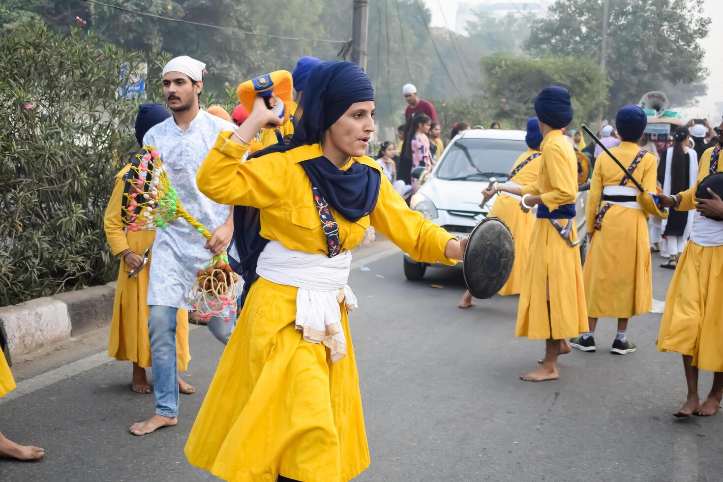 Delhi, India, May 2, 2024 - Sikhs display gatka and martial arts during annual Nagar Kirtan, Traditional, procession on account of birthday of Guru Nanak Dev ji, Nagar Kirtan in East Delhi area photo