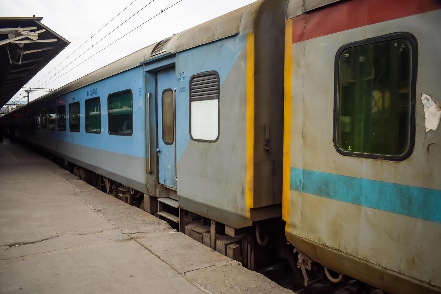 Amritsar, India, May 10 2024 - Indian railway train at Amritsar railway station platform during morning time, Colourful train at Amritsar, Punjab railway station photo