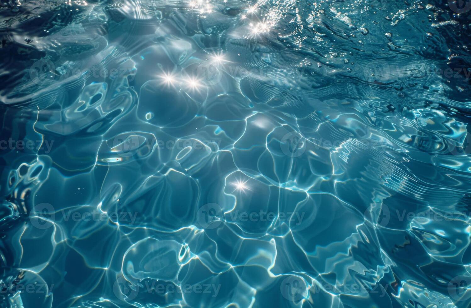 Blue water surface with shimmering reflections and ripples, creating a serene and tranquil scene. photo
