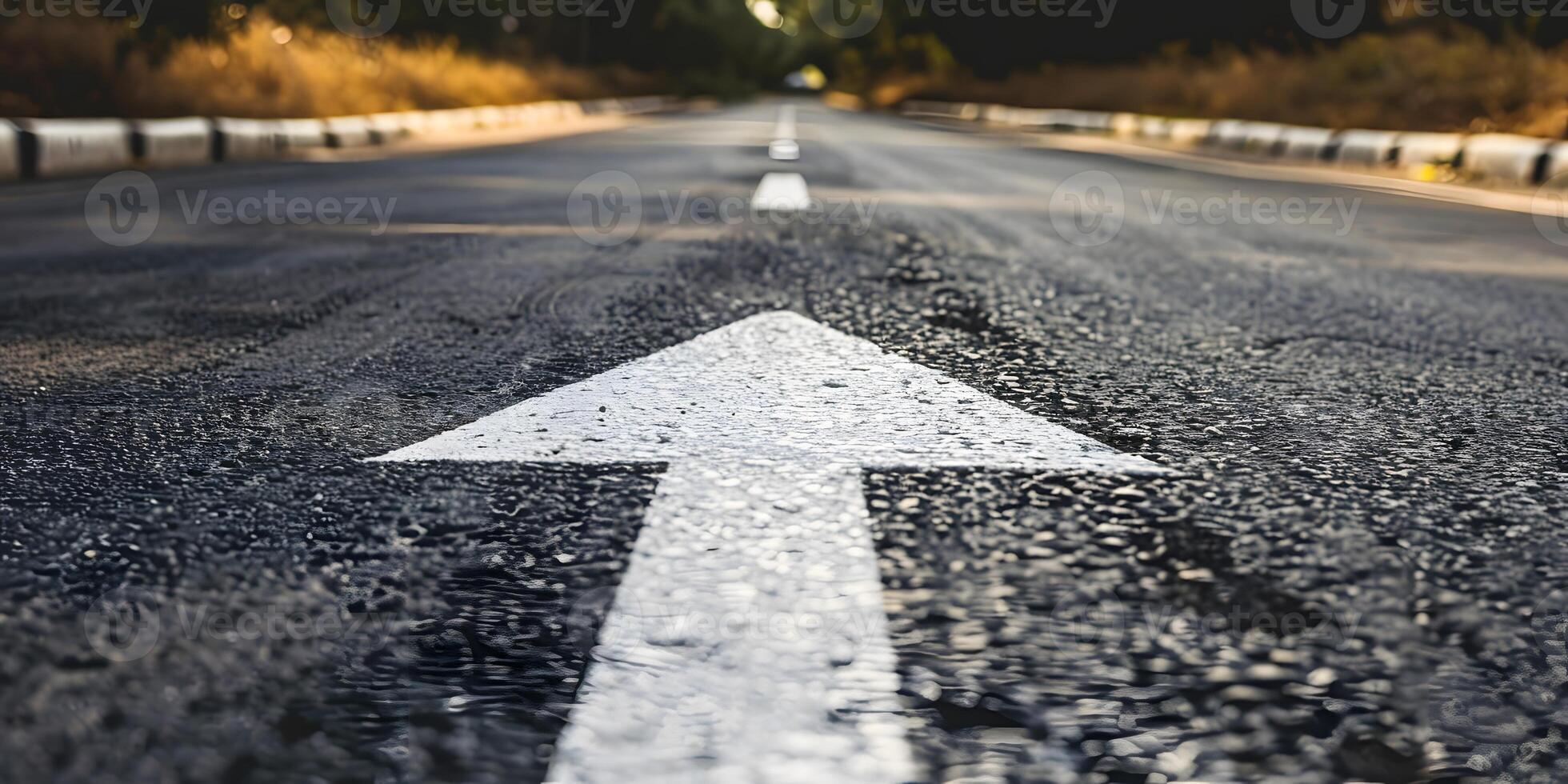 An asphalt road stretches into the distance with a painted white arrow pointing forward, symbolizing motivation, progress photo