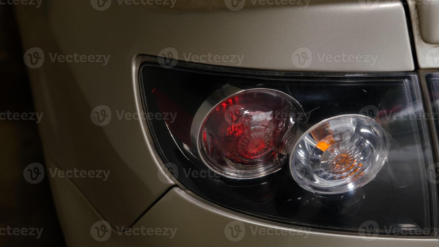 Back lights of white car,While flaming red. photo