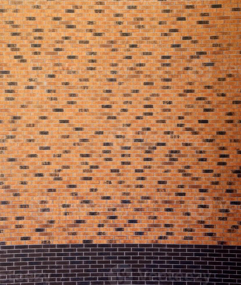 Dark brick wall pattern with chaotic masonry order. Background texture or resource for 3d texturing. Many bricks in big modern stone wall photo