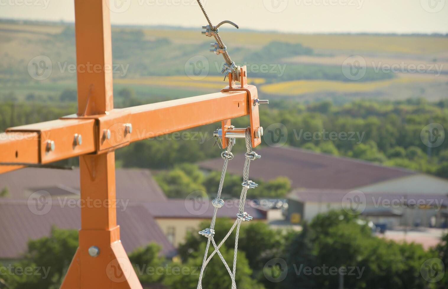 Rope lockers in ending of front beam of suspended wire rope platform for facade works on high multistorey buildings. Rope lockers blocks kink for safety platform usage photo