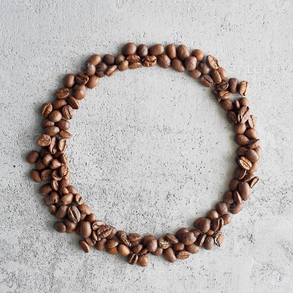 A circle of coffee beans. A place for text.Caffeine addiction. photo