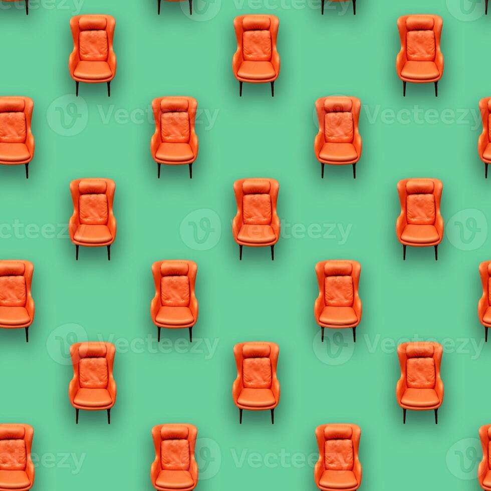 Square pattern, juicy orange chair on a green mint background.Interior for active and young people. photo