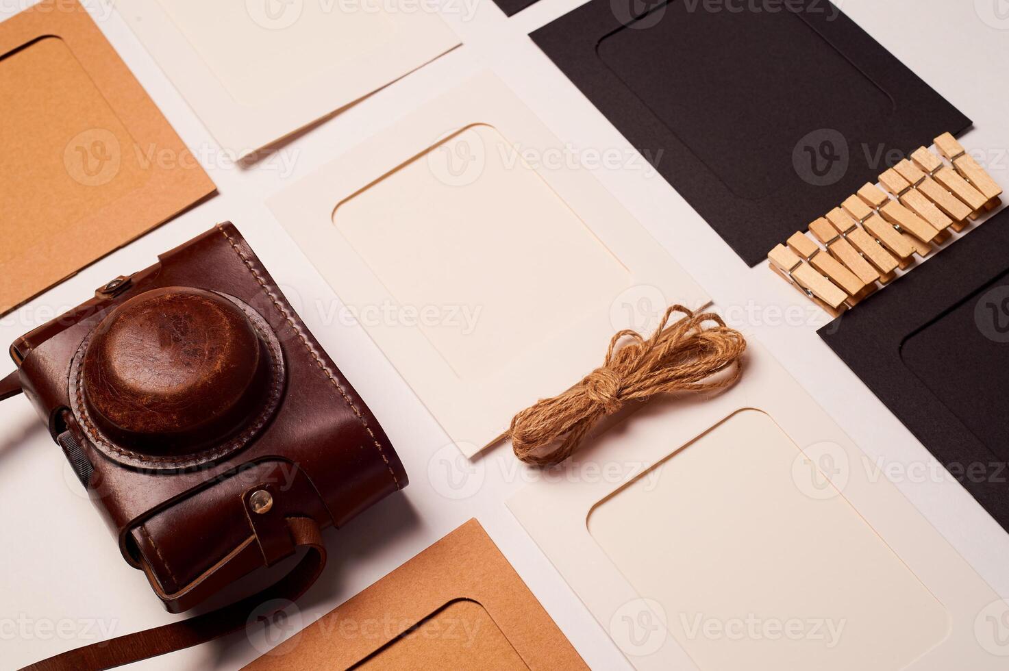 Storage and archiving of photos.Paper frames for photos, an old film camera in the case. Preserving your history. Photo Art.