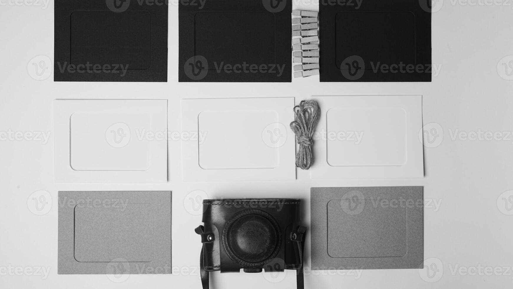 Storage and archiving of photos.Paper frames for photos, an old film camera in the case. Preserving your history. Photo Art.