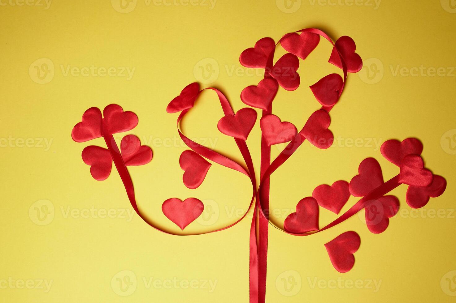 Valentine's day,a Declaration of love. Tree of love from a heart and a ribbon. Yellow background. photo