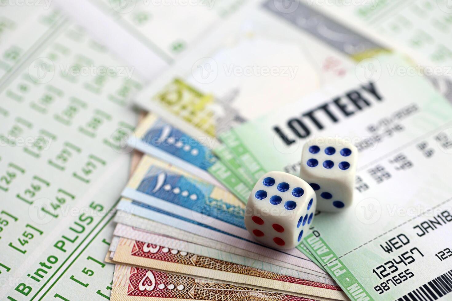 Green lottery tickets and iranian money bills on blank with numbers for playing lottery photo