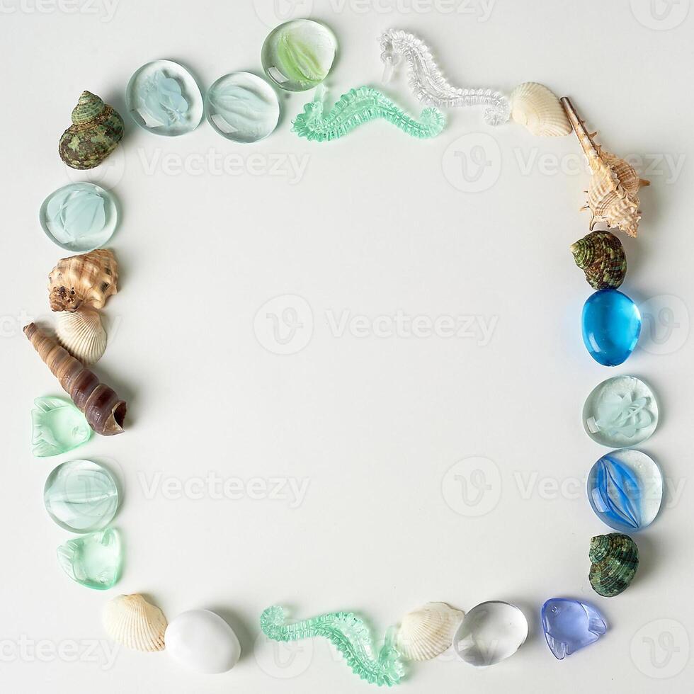 The layout of sea shells, the artwork from the sea.Little things to remember your vacation. The form of a square. An empty space in the middle. photo