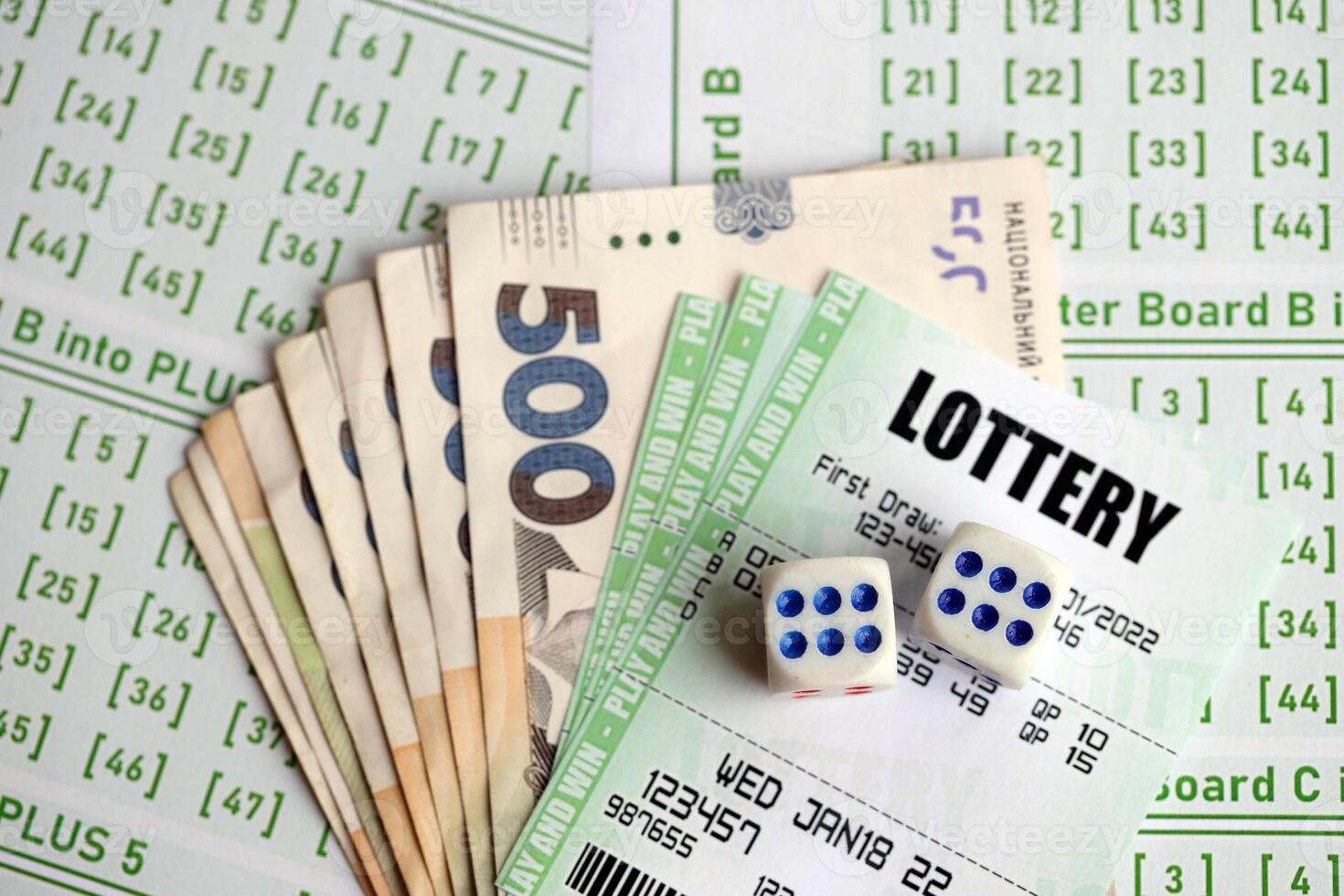 Green lottery tickets and ukrainian money bills on blank with numbers for playing lottery photo