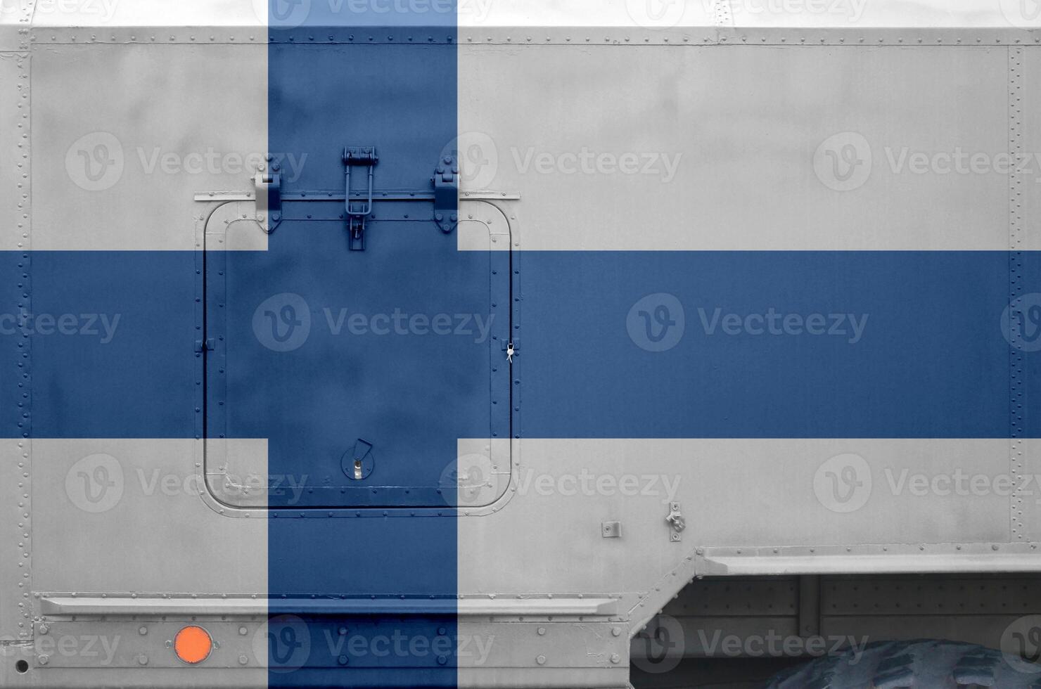 Finland flag depicted on side part of military armored truck closeup. Army forces conceptual background photo