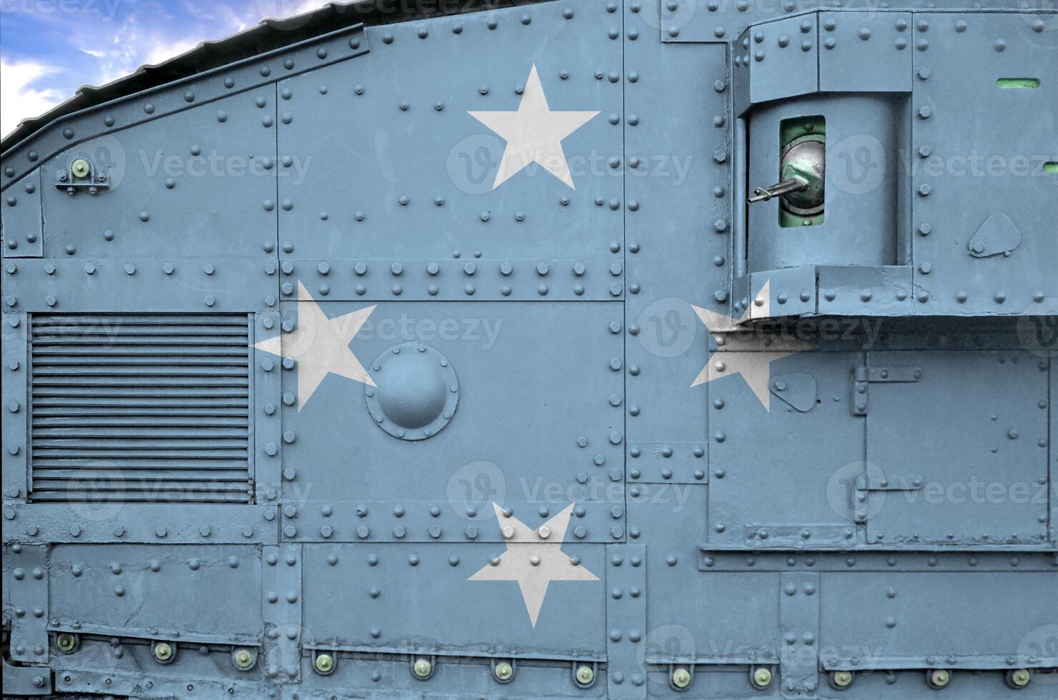 Micronesia flag depicted on side part of military armored tank closeup. Army forces conceptual background photo