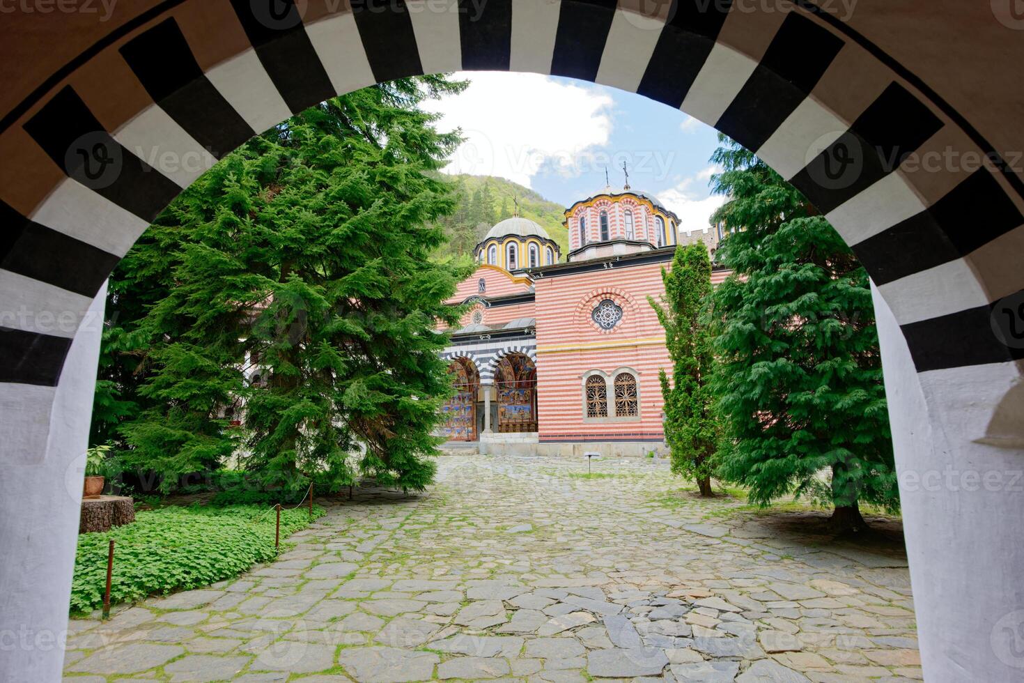 View of the Rila Monastery, the largest and most famous Eastern Orthodox monastery in Bulgaria. Famous tourist attractions. Place of worship. photo
