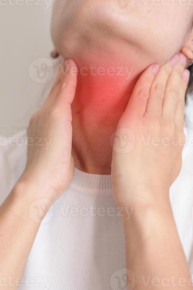 Woman checking Thyroid gland disease. Hand holding Neck pain. Hyperthyroidism, Hypothyroidism, Hashimoto Thyroiditis, Thyroid Tumor and Cancer, Postpartum, Papillary Carcinoma and Health concept photo