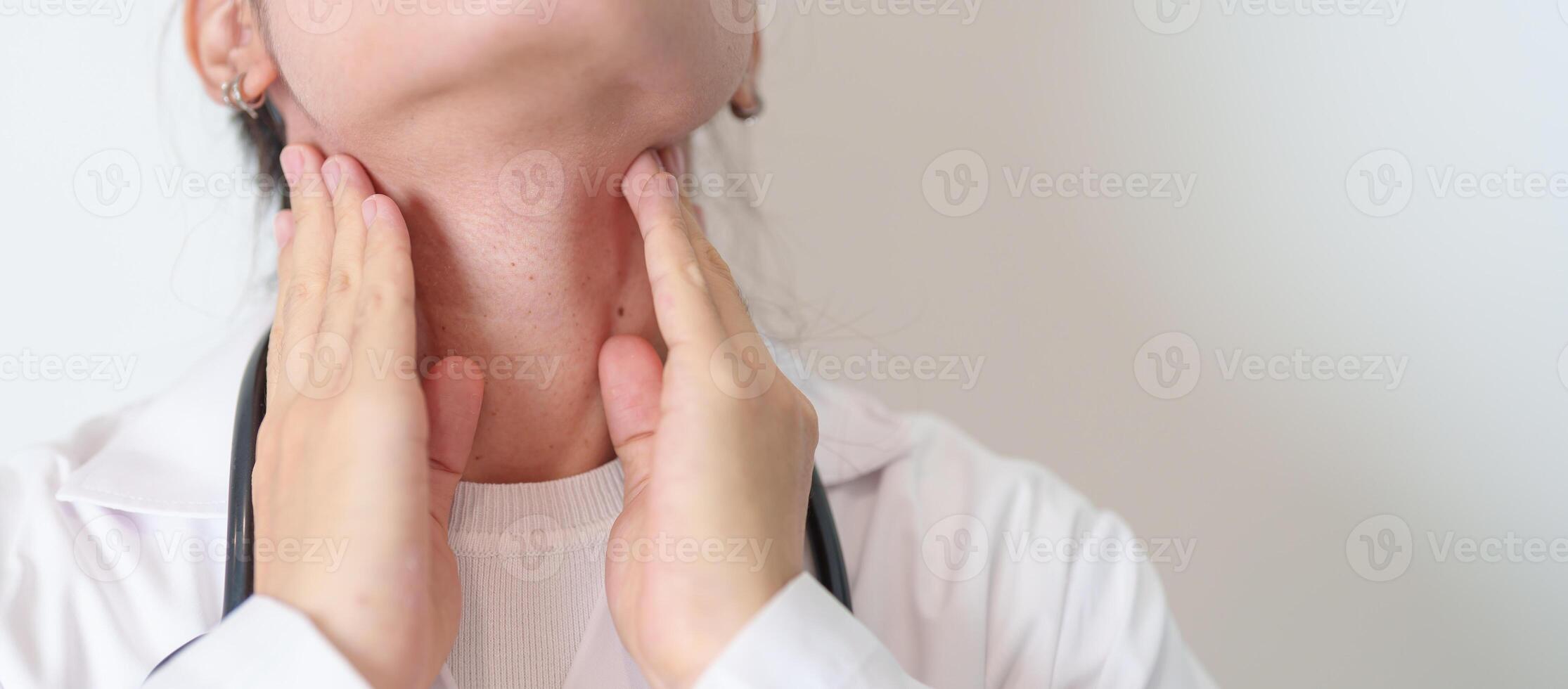 Woman checking Thyroid gland disease. Hand holding Neck pain. Hyperthyroidism, Hypothyroidism, Hashimoto Thyroiditis, Thyroid Tumor and Cancer, Postpartum, Papillary Carcinoma and Health concept photo