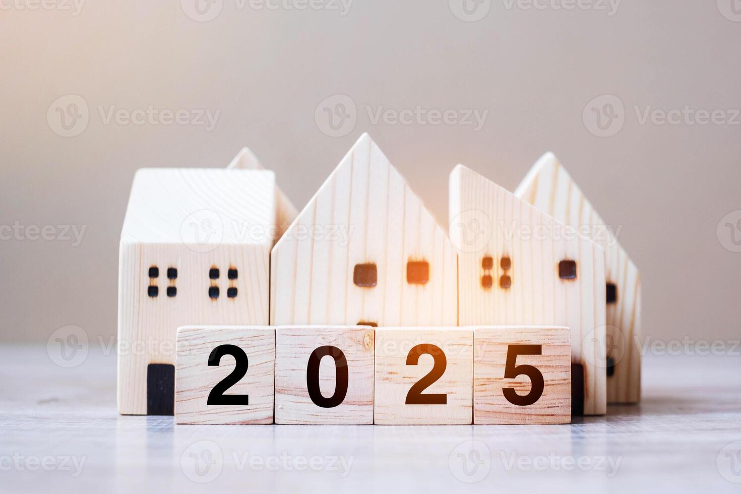 2025 Happy New Year with house model on table wooden background. Banking, real estate, investment, financial, savings and New Year Resolution concepts photo