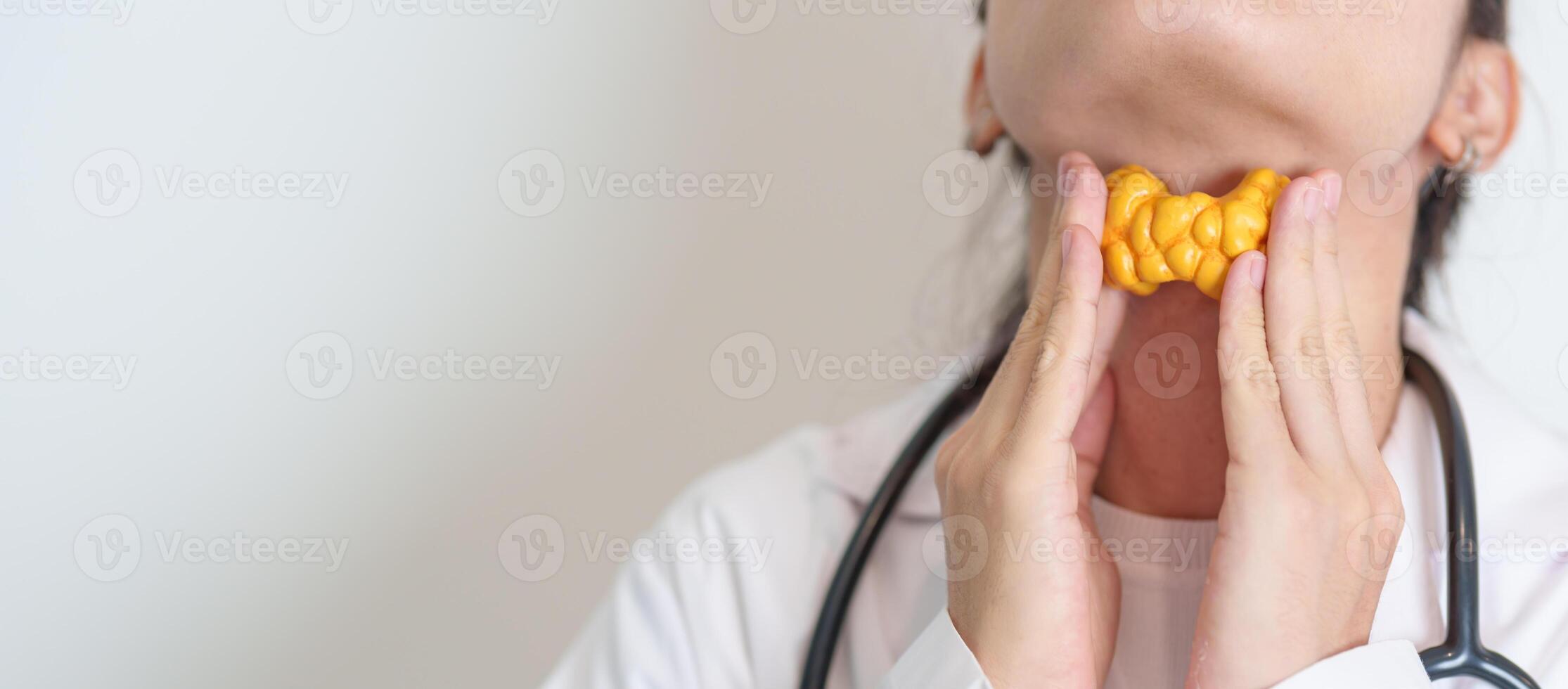 Doctor with human Thyroid anatomy model. Hyperthyroidism, Hypothyroidism, Hashimoto Thyroiditis, Thyroid Tumor and Cancer, Postpartum, Papillary Carcinoma and Health concept photo