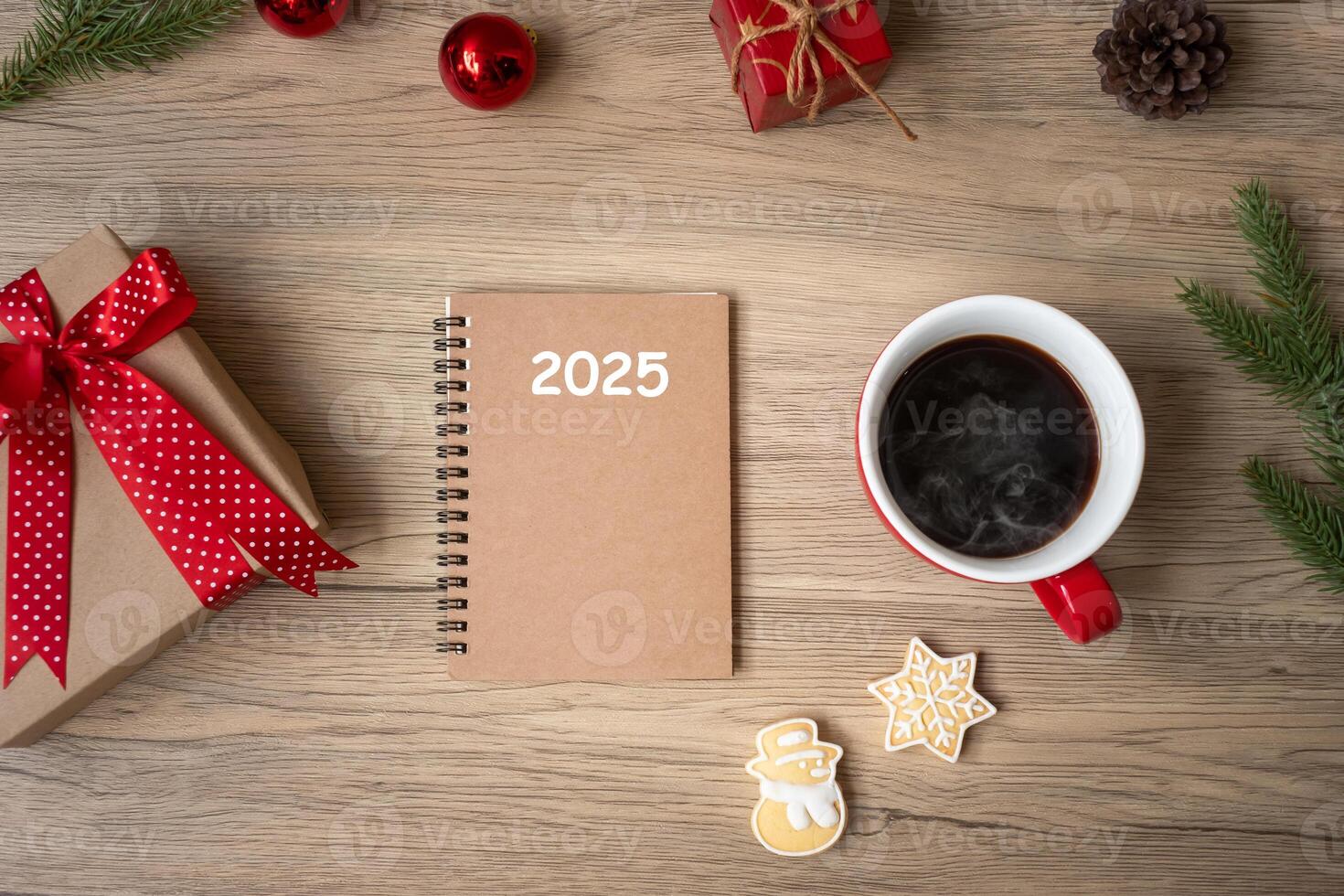 2025 notebook, black coffee cup, Christmas cookies and pen on wood table, Top view and copy space. Xmas, Happy New Year, Goals, Resolution, To do list, Strategy and Plan concept photo