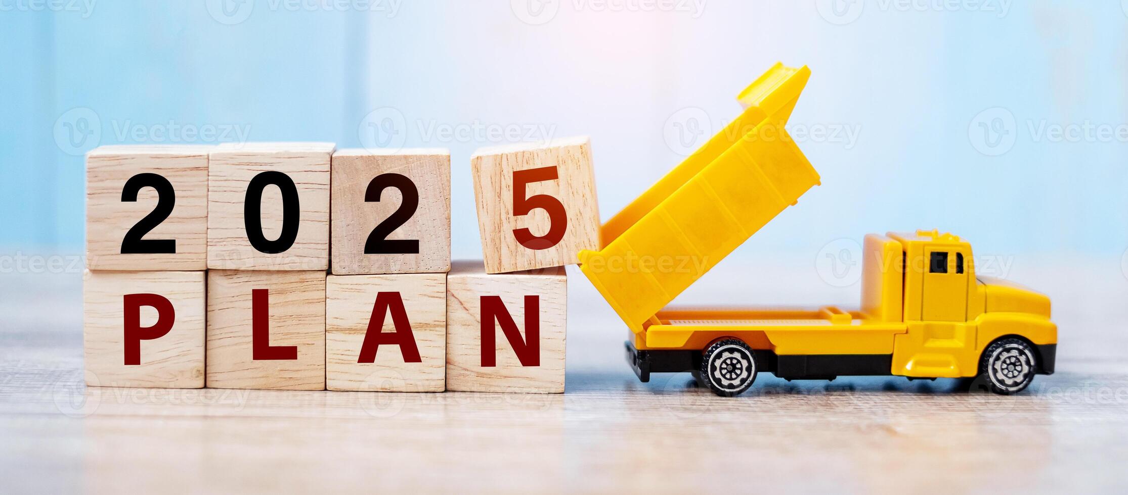 2025 Plan cube blocks with miniature truck or construction vehicle. New Start, Vision, Resolution, goal, industrial, Warehouse and happy New Year concept photo