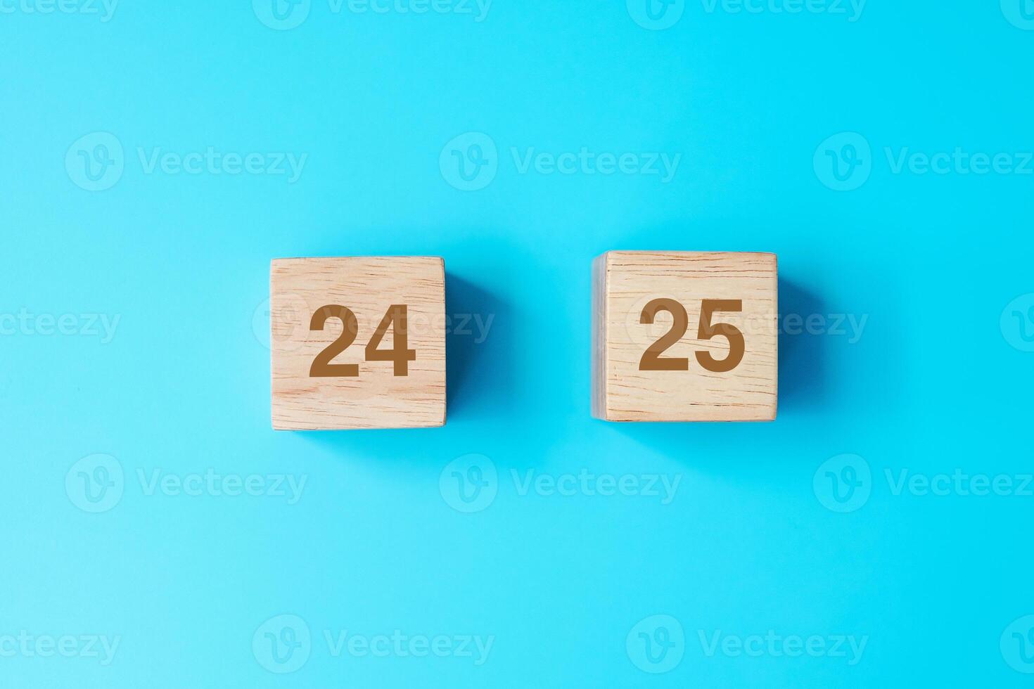 wooden cube block with 2025 text on blue background. Resolution, plan, review, goal, start and New Year holiday concepts photo