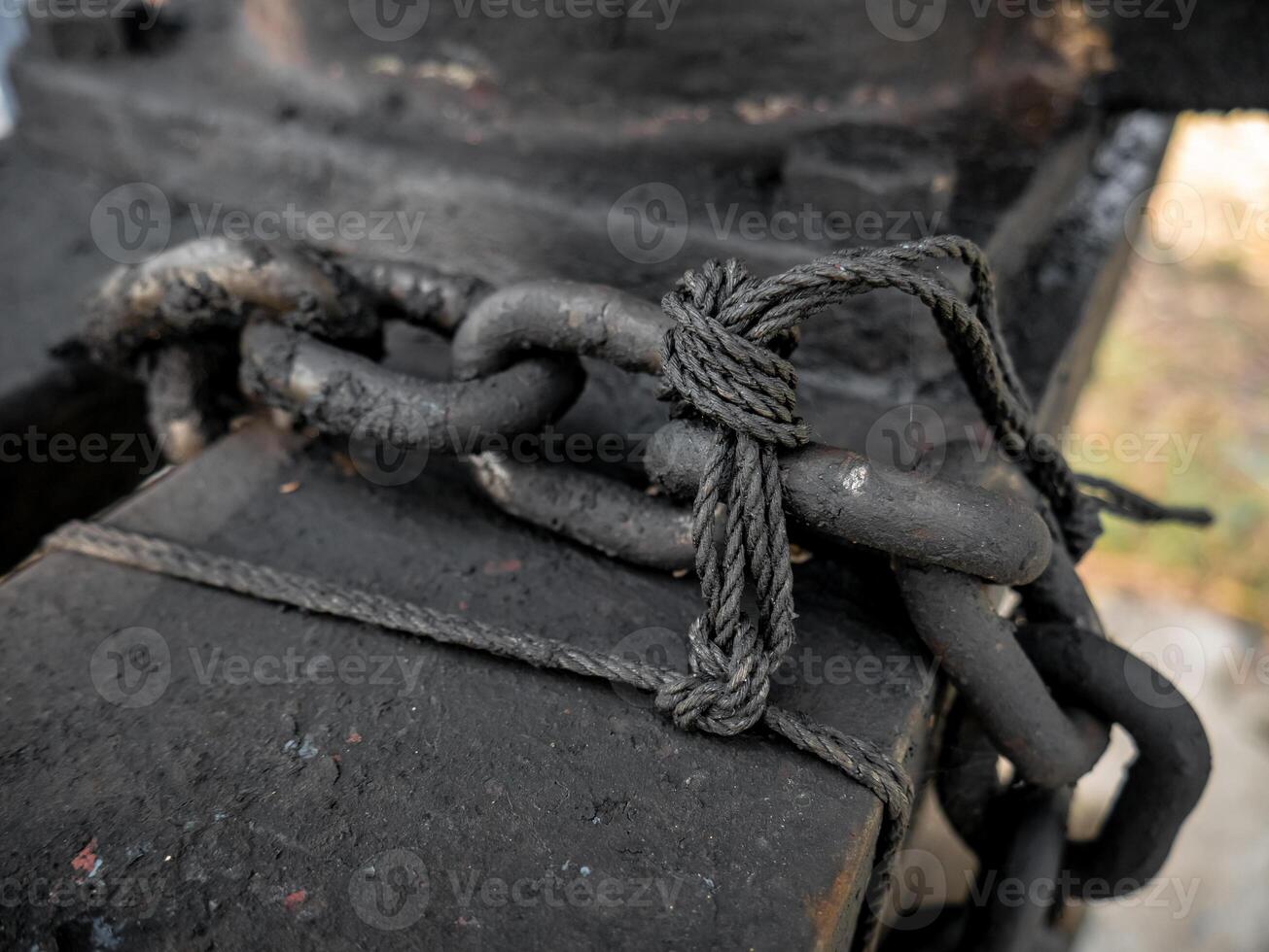the chain is black because it is covered in dried used oil photo