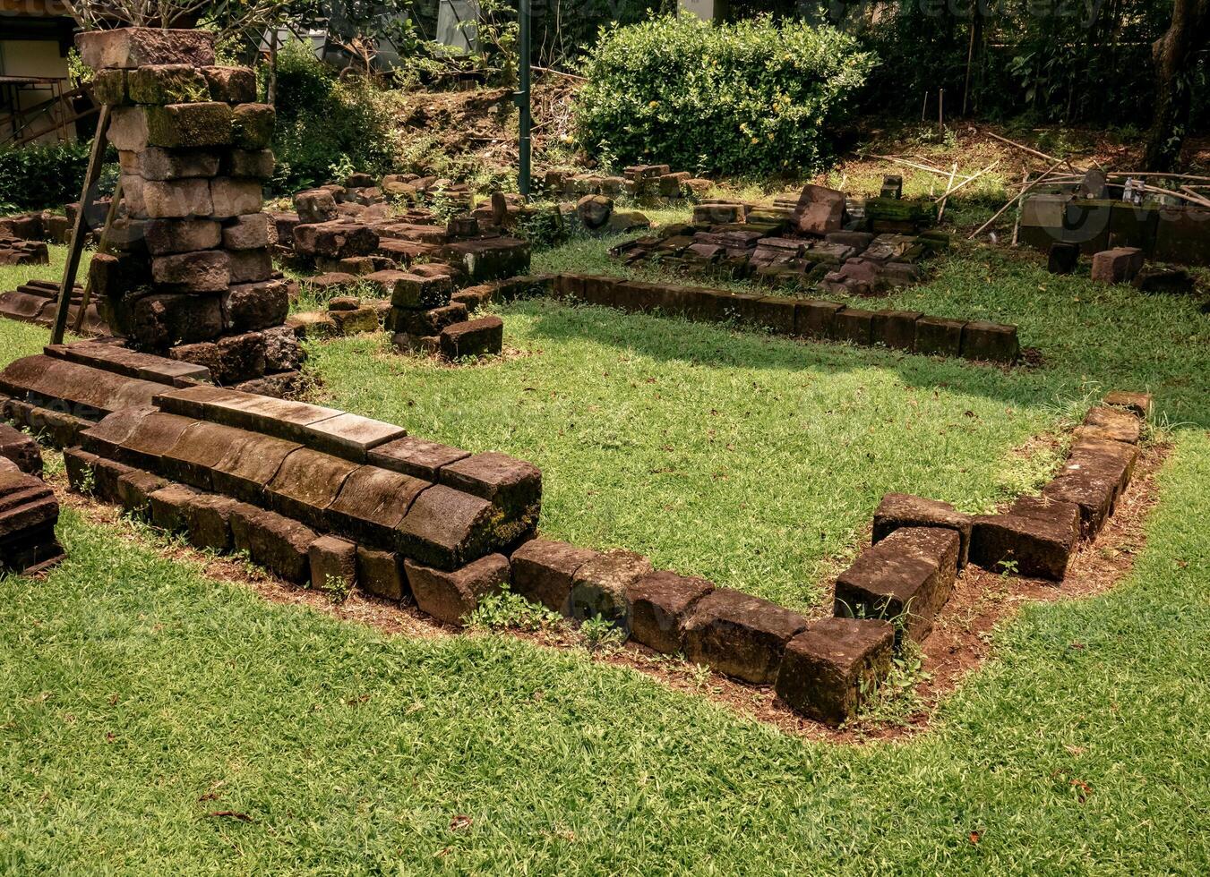 Ancient temple stones arranged to be restored to become a temple photo