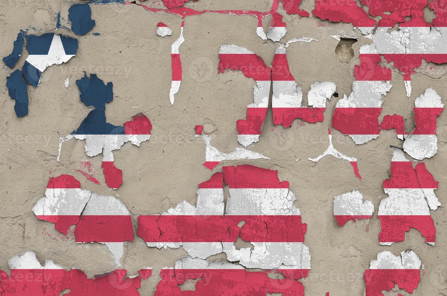 Liberia flag depicted in paint colors on old obsolete messy concrete wall closeup. Textured banner on rough background photo
