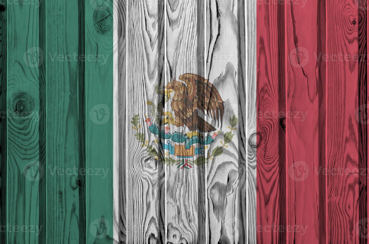 Mexico flag depicted in bright paint colors on old wooden wall. Textured banner on rough background photo