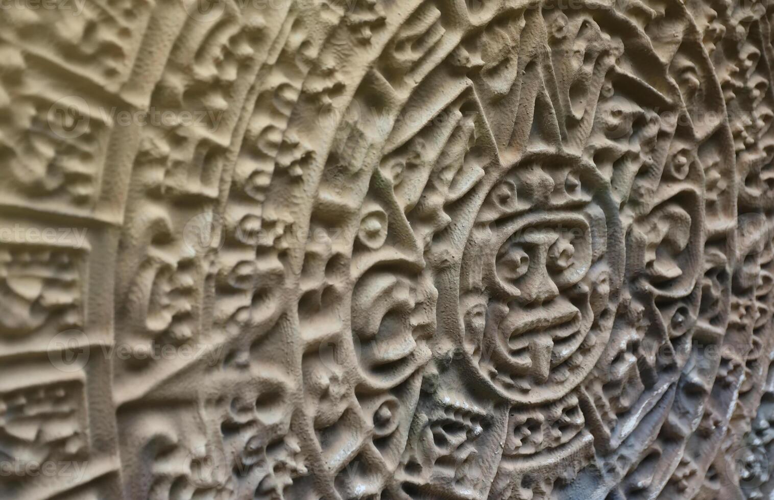 Ancient Mayan Calendar or Aztec calendar with rough relief surface photo