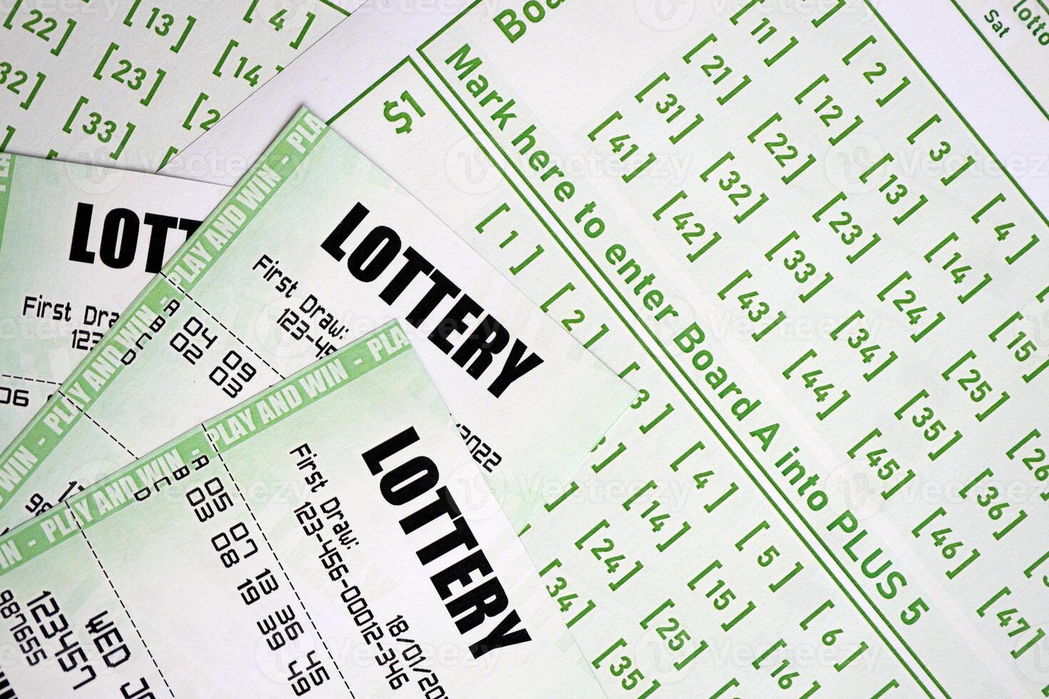 Green lottery tickets and blank bills with numbers for playing lottery photo