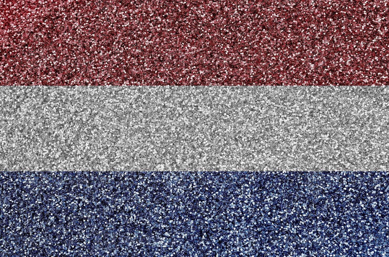 Netherlands flag depicted on many small shiny sequins. Colorful festival background for party photo
