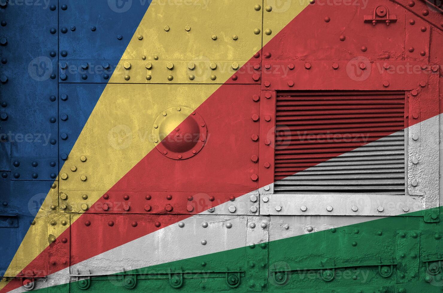 Seychelles flag depicted on side part of military armored tank closeup. Army forces conceptual background photo