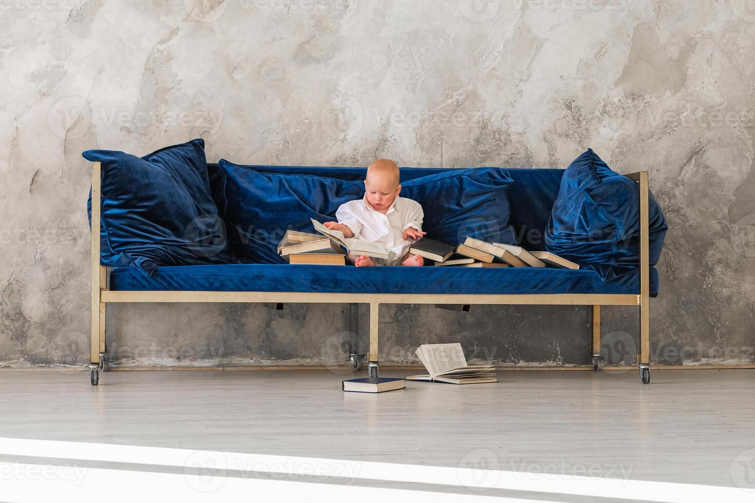 Girl sitting on sofa .Girl reading book photo