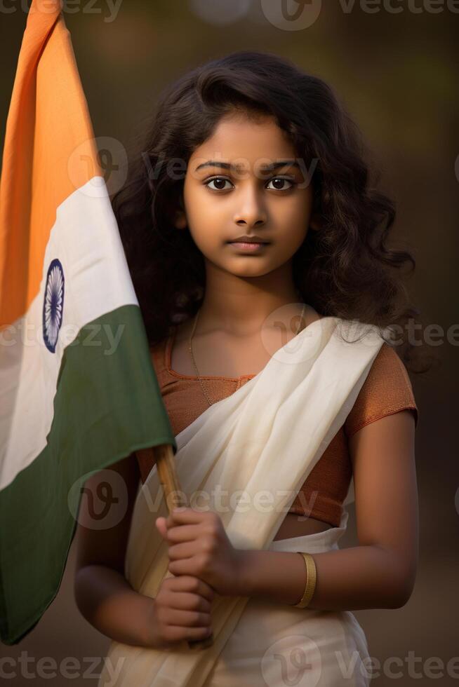 Young Indian girl holding Indian flag, symbolizing patriotism and national pride. Celebrating Indian Independence Day. Love for the country. Vertical format. photo
