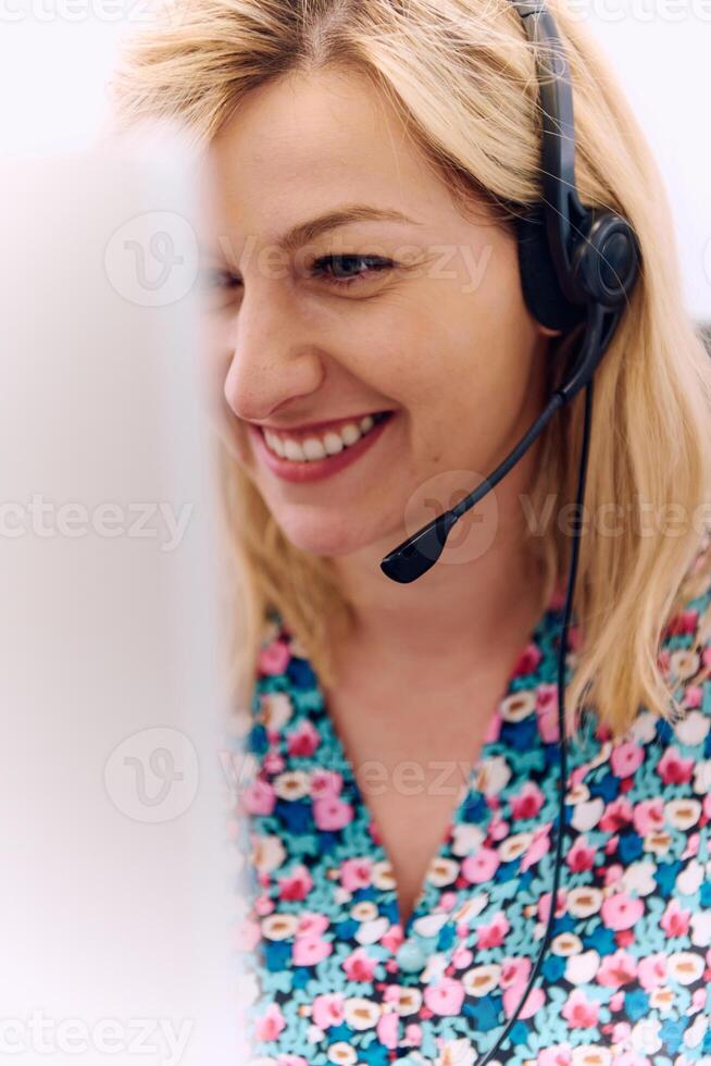 Friendly Call Center Agent Answering Incoming Calls with Headset Providing Remote Customer Service. photo