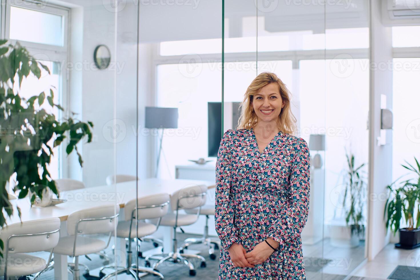 Radiant Businesswoman. A Vibrant Presence in the Company Corridor photo