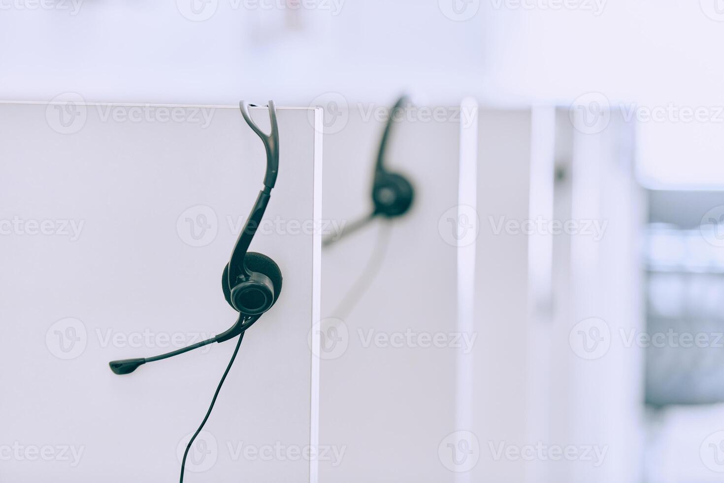 Close up of Headphones Awaiting the New Workday in the Call Center. photo