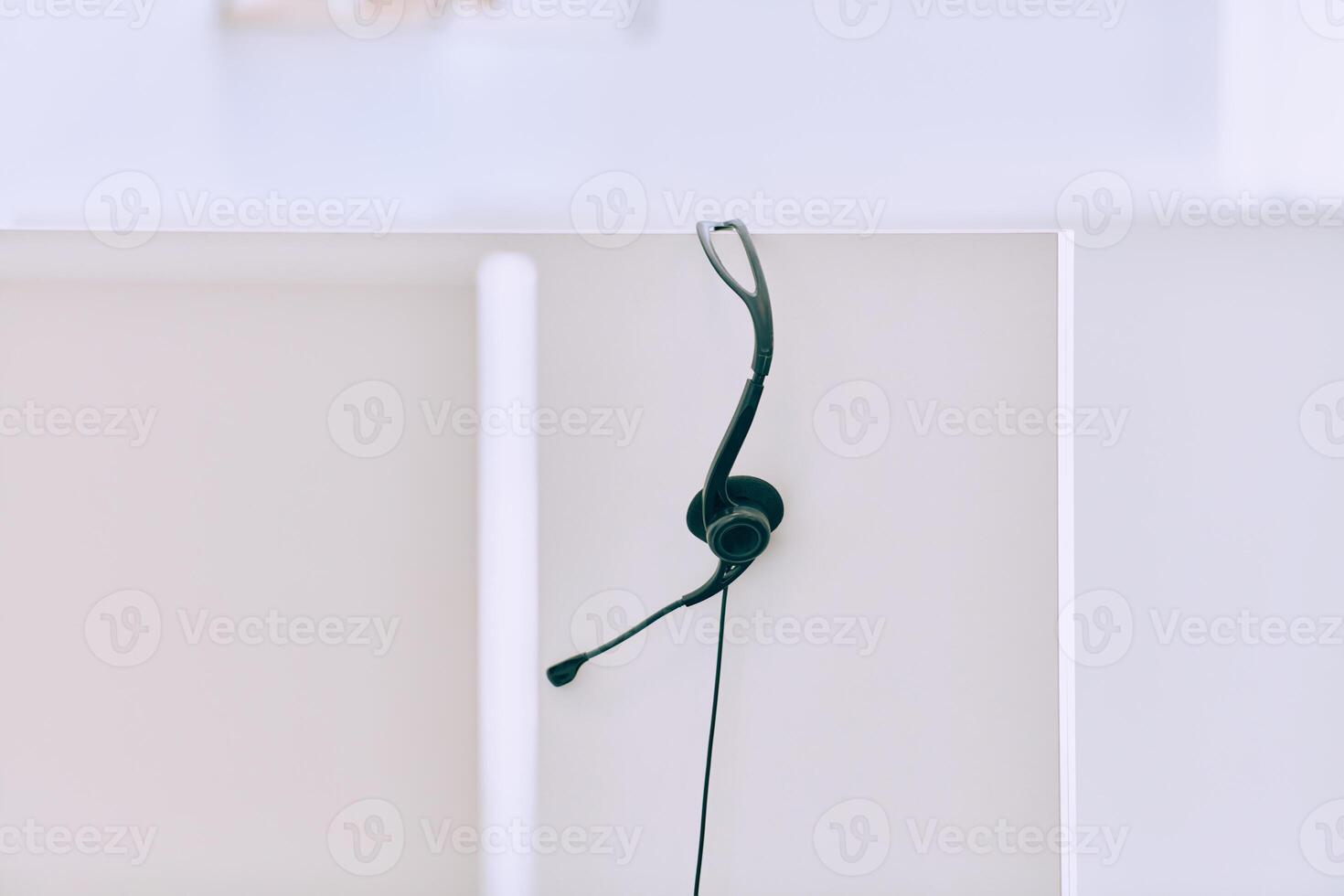 Close up of Headphones Awaiting the New Workday in the Call Center. photo