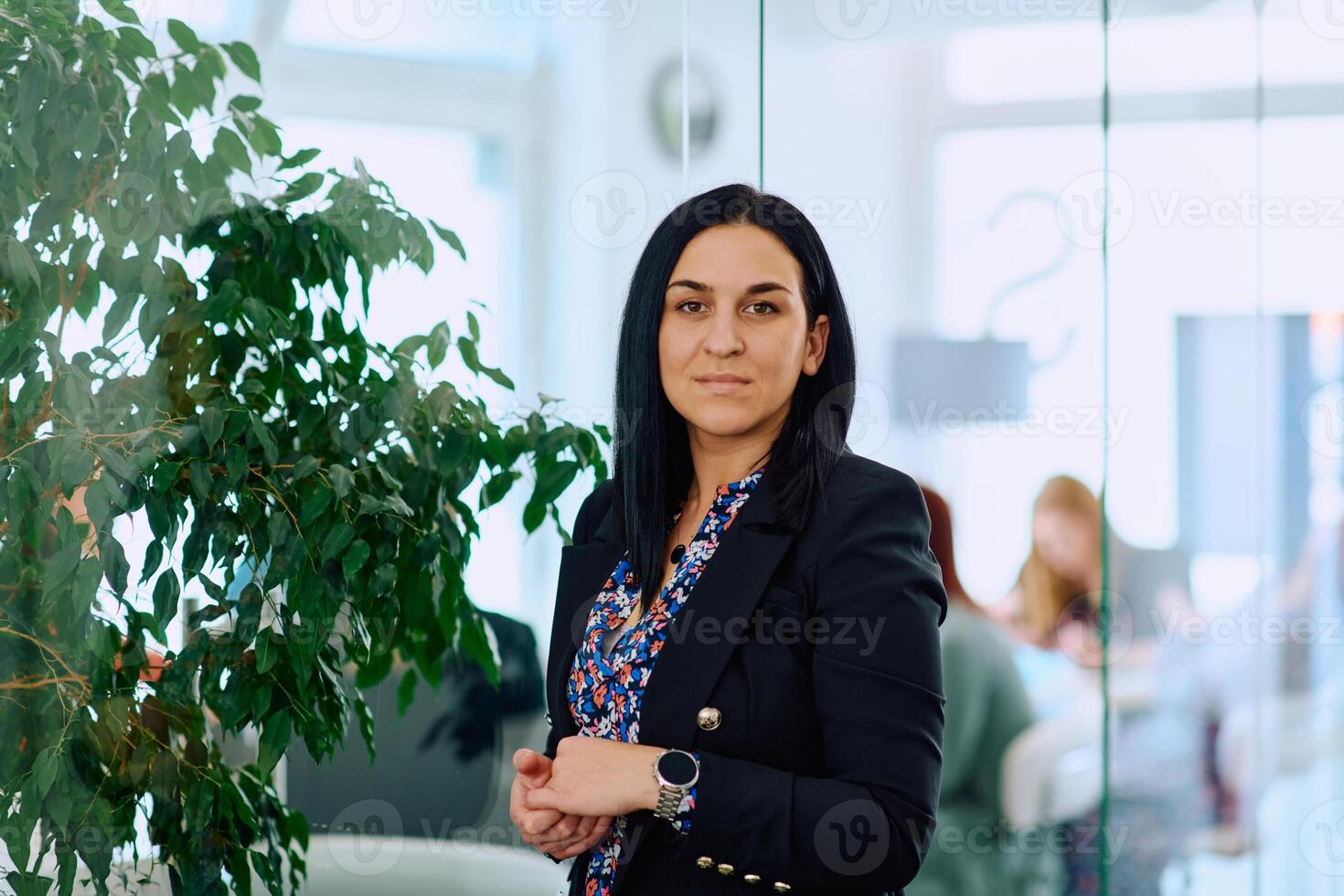 Portrait of a Confident Businesswoman with Crossed Arms in Her Office Environment. photo