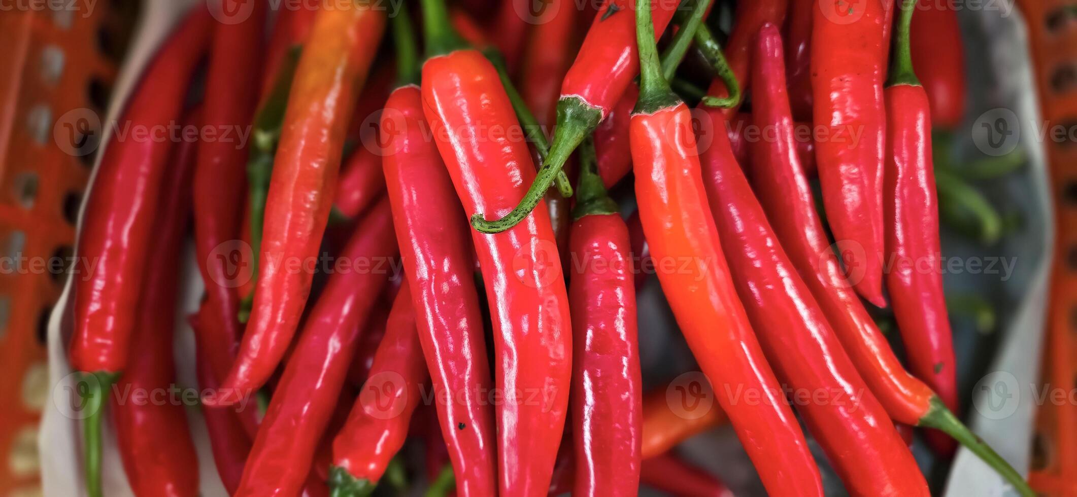 Red hot chilli peppers texture background, close up, A backdrop of Red hot chilli peppers, Street vegetable market, Group of Red hot chilli peppers photo