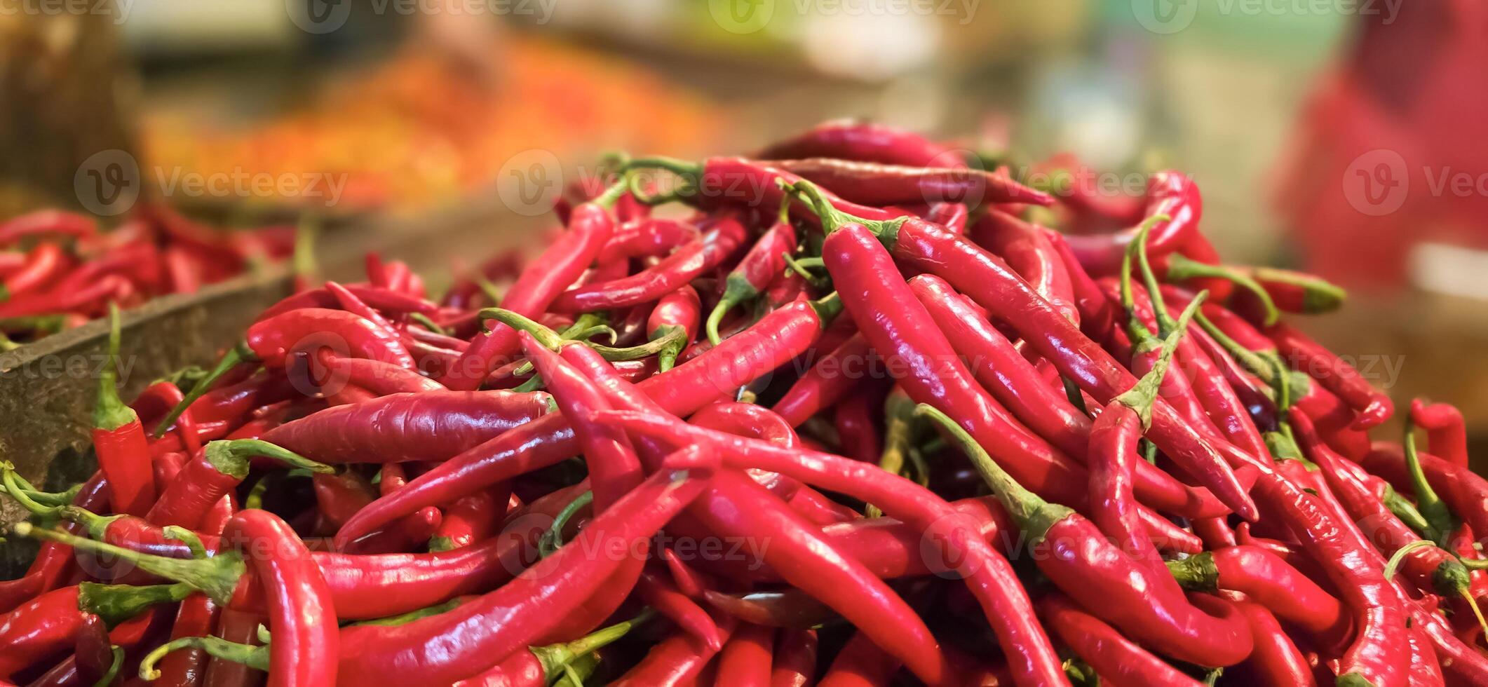 Red hot chilli peppers texture background, close up, A backdrop of Red hot chilli peppers, Street vegetable market, Group of Red hot chilli peppers photo