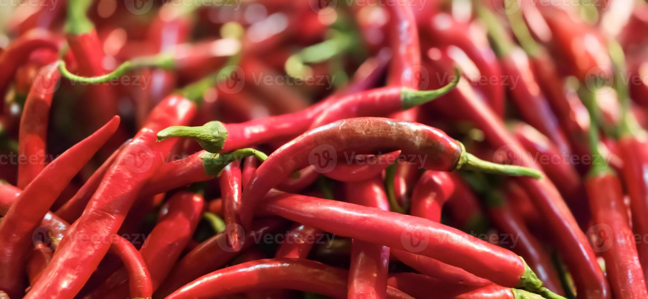 Red hot chilli peppers texture background, close up, A backdrop of Red hot chilli peppers, Street vegetable market, Group of Red hot chilli peppers photo