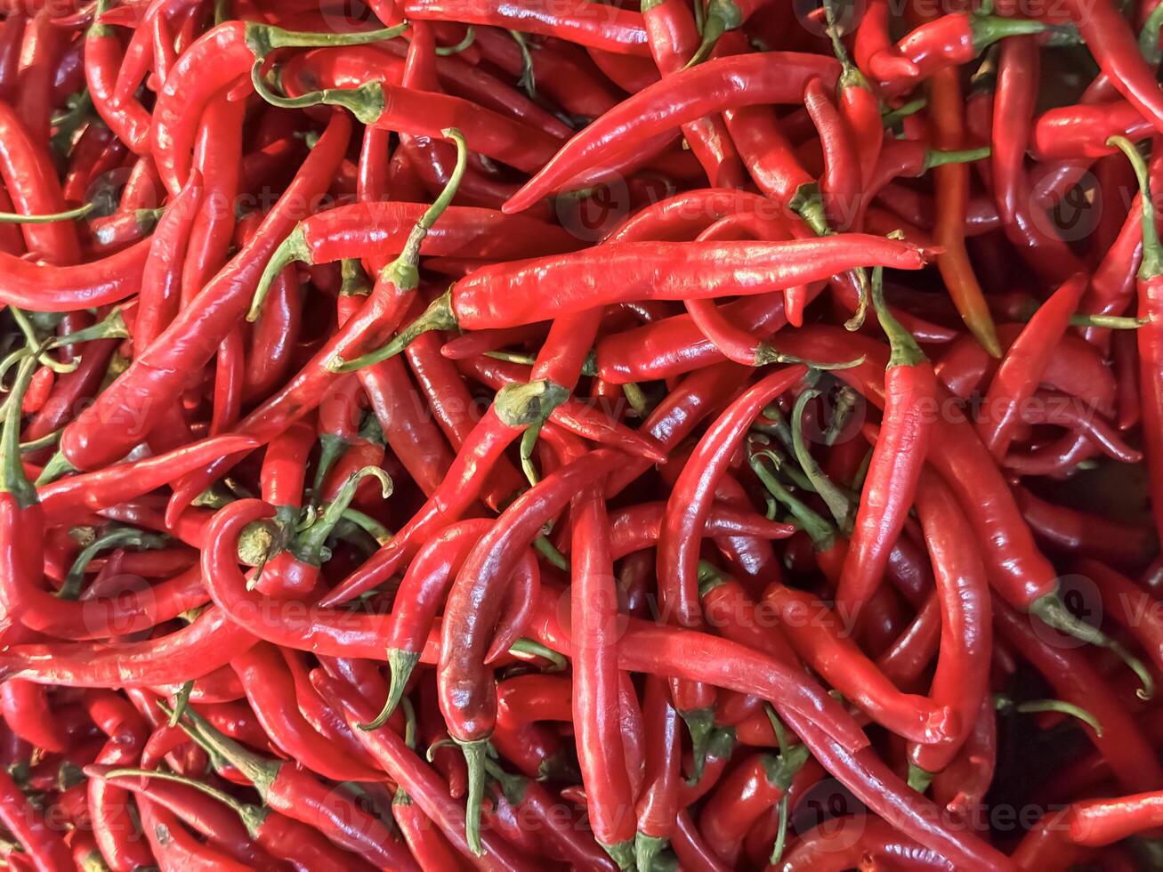 Red hot chilli peppers texture background, close up, A backdrop of Red hot chilli peppers, Street vegetable market, Group of Red hot chilli peppers photo