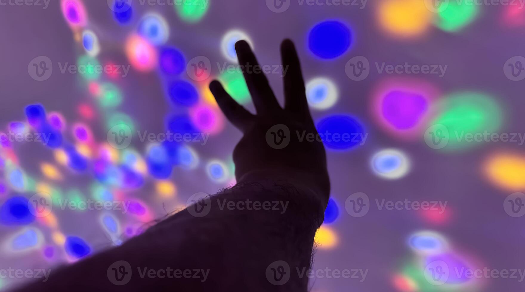 Hand gesture silhouette on a colorful background reaching out, saying hello, and show number represent photo