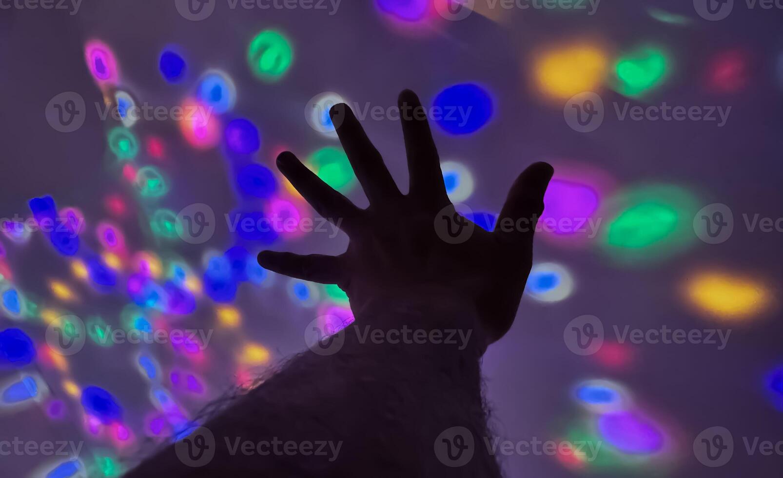 Hand gesture silhouette on a colorful background reaching out, saying hello, and show number represent photo