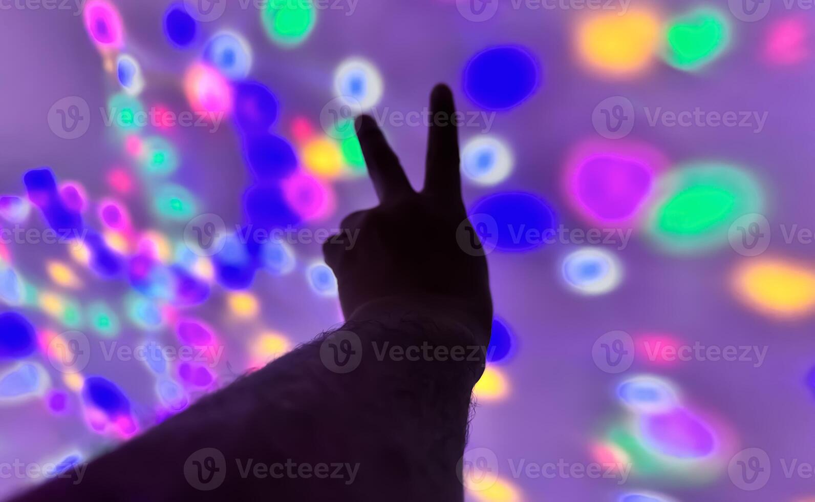Hand gesture silhouette on a colorful background reaching out, saying hello, and show number represent photo